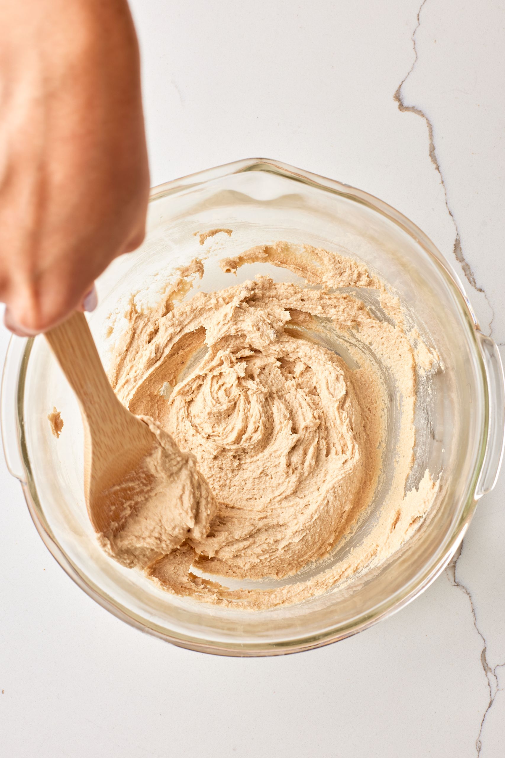 Step-by-step instructions on how to make Chocolate Peanut Butter stuffed cookies: cream softened butter and sugar until light and fluffy. 