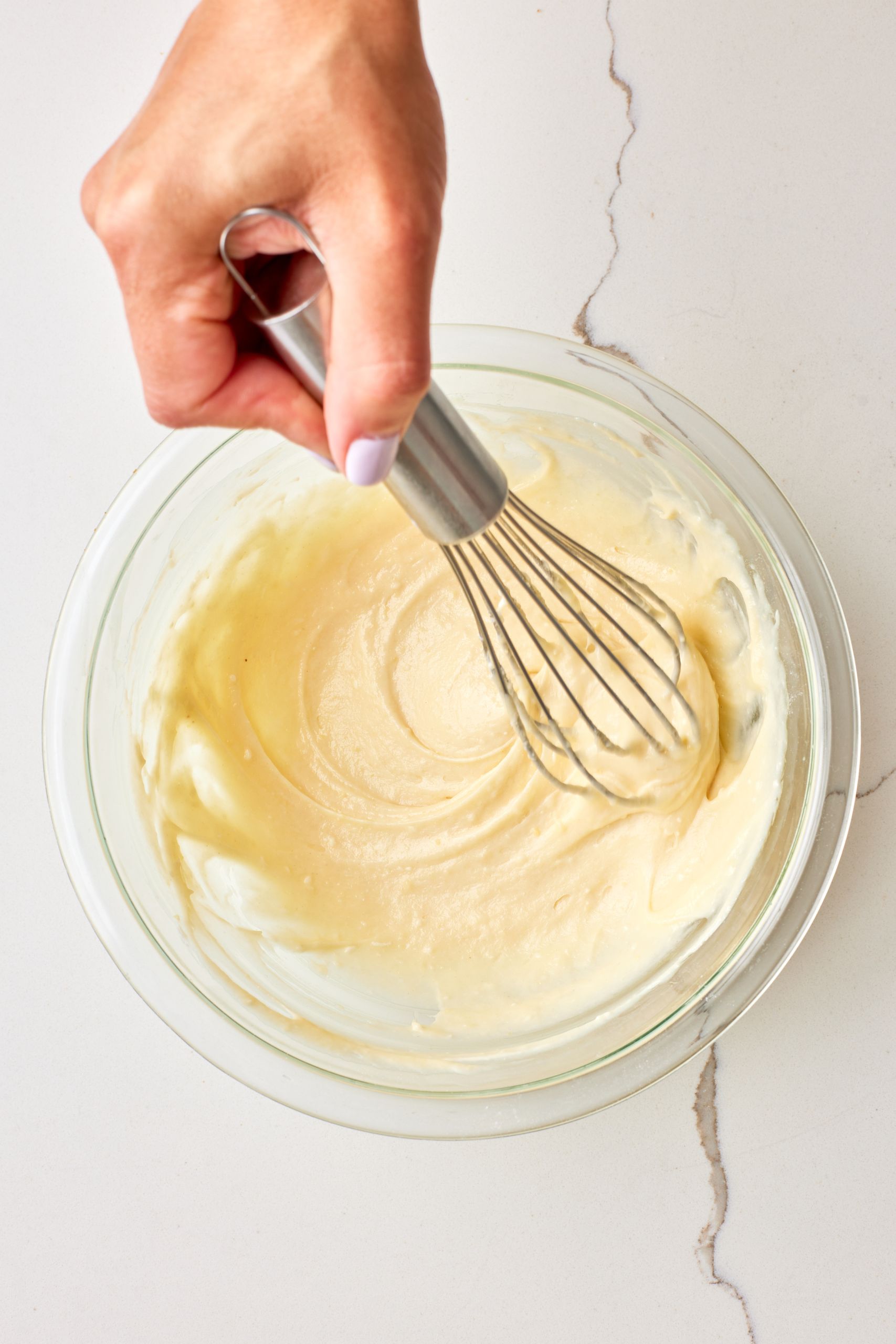 Step-by-step instructions on how to make Pumpkin Cream Cheese bread: Whisk the cream cheese mixture ingredients.