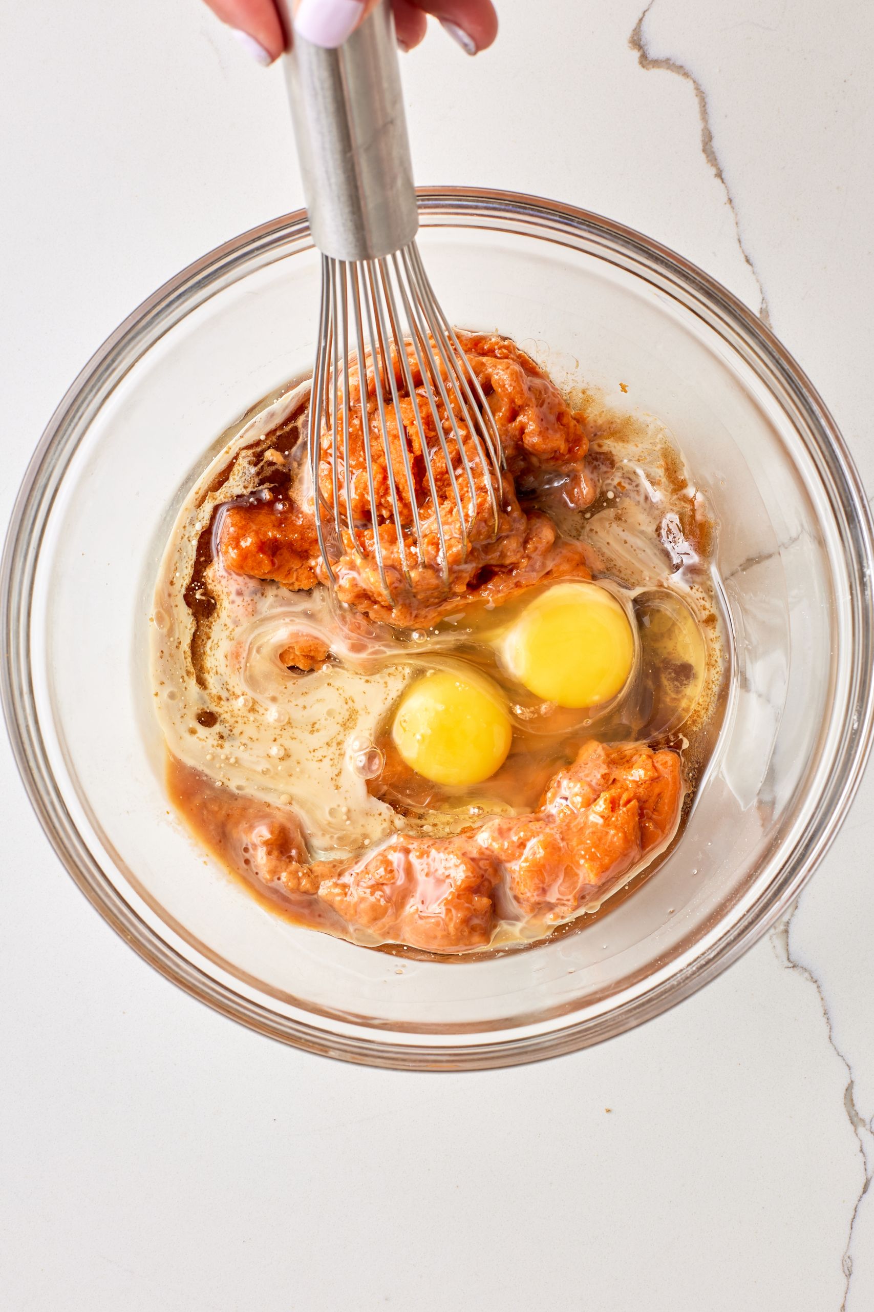 Mix the wet ingredients: In a medium bowl, whisk together the eggs, pumpkin puree, brown sugar, oil, milk and vanilla extract until smooth.