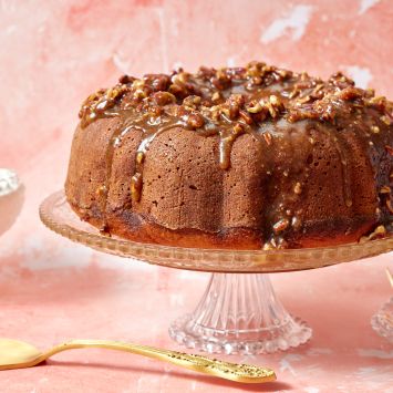 Sweet Potato Pound Cake drizzled with pecan glaze , served with whipped cream on the side.