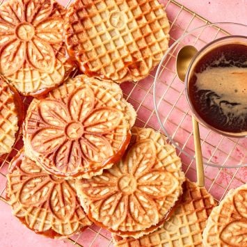 Top-down view of Stroopwafels with beautiful patterns served with coffee