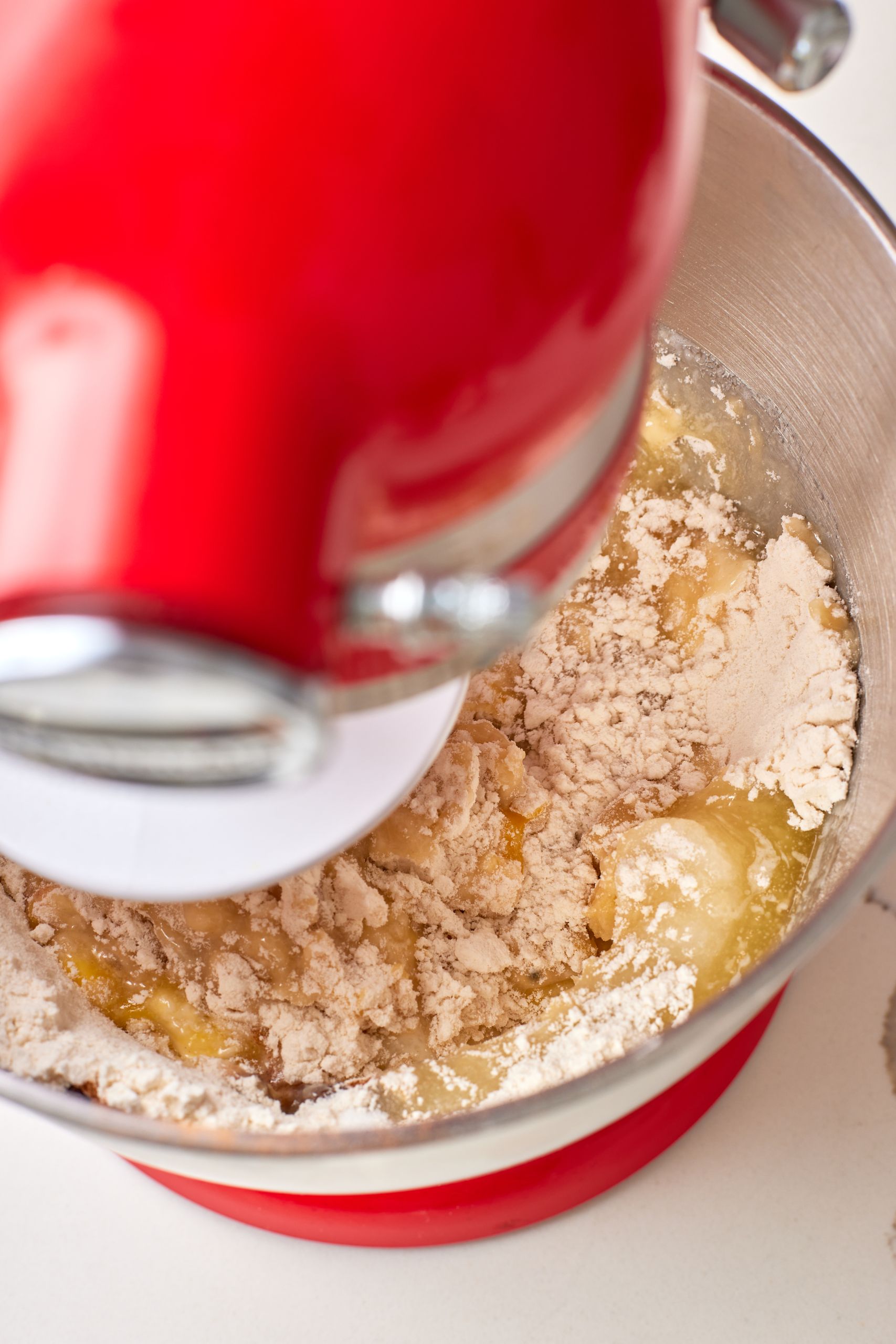 Step-by-step instructions on how to make Stroopwafels: combine all ingredients in the bowl of a stand mixer. 