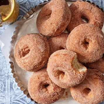 A plate od potato donuts served with coffee