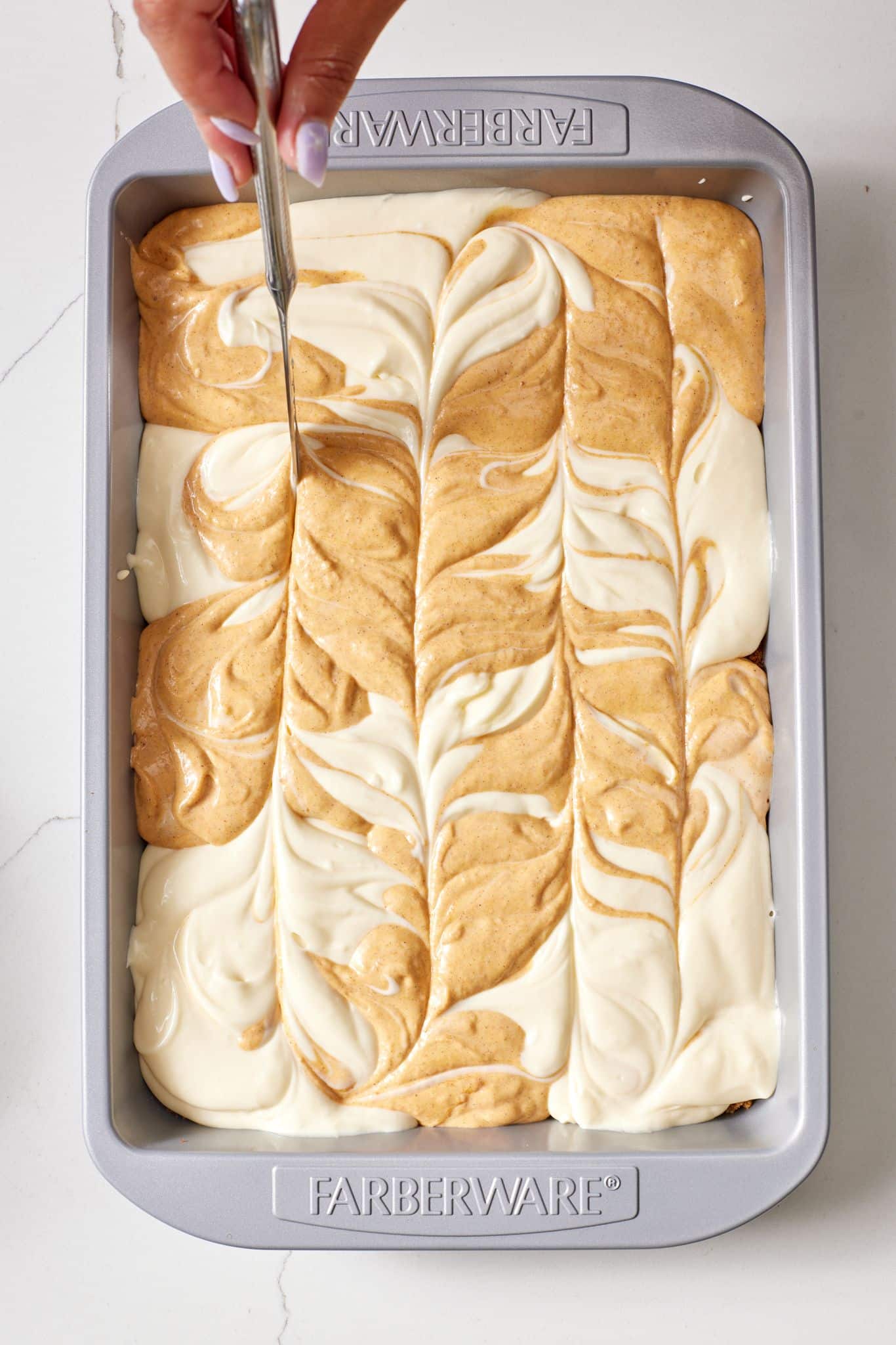 Pumpkin Cheesecake Bars10 Swirl the fillings.