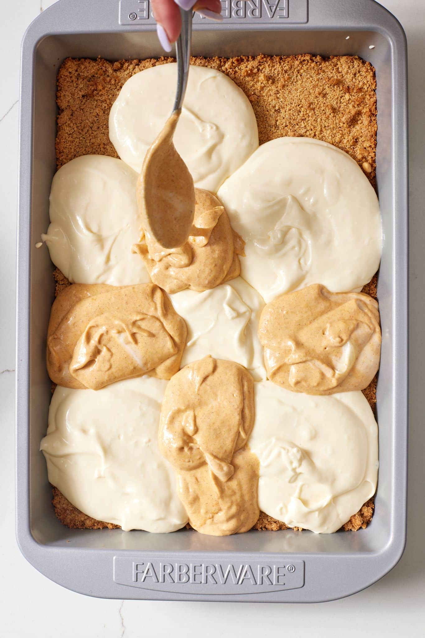 Pumpkin Cheesecake Bars9 Arrange two fillings into the pan.