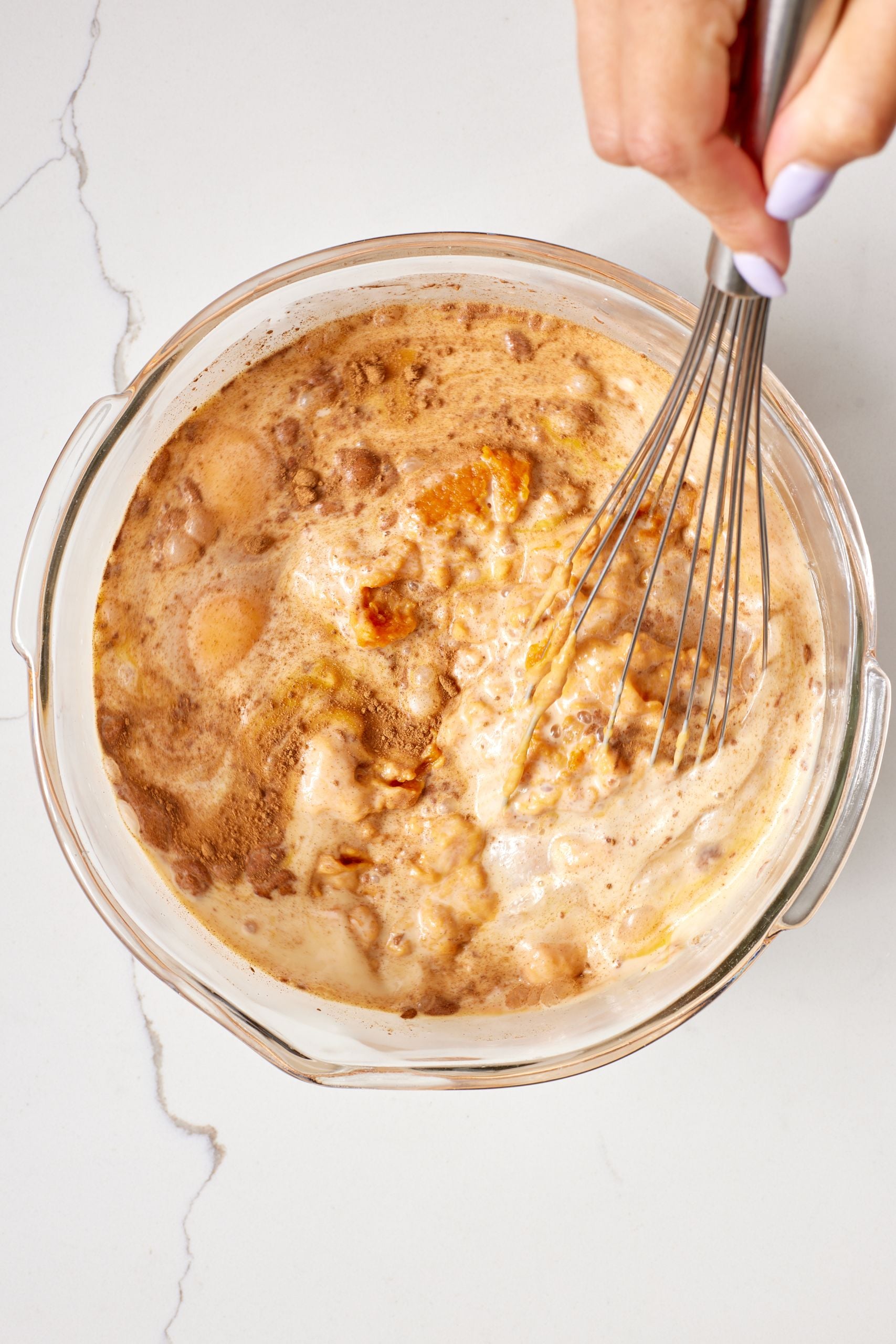 Step-by-step instructions on how to make Pumpkin Pie Bars: combine dry ingredients and wet ingredients.