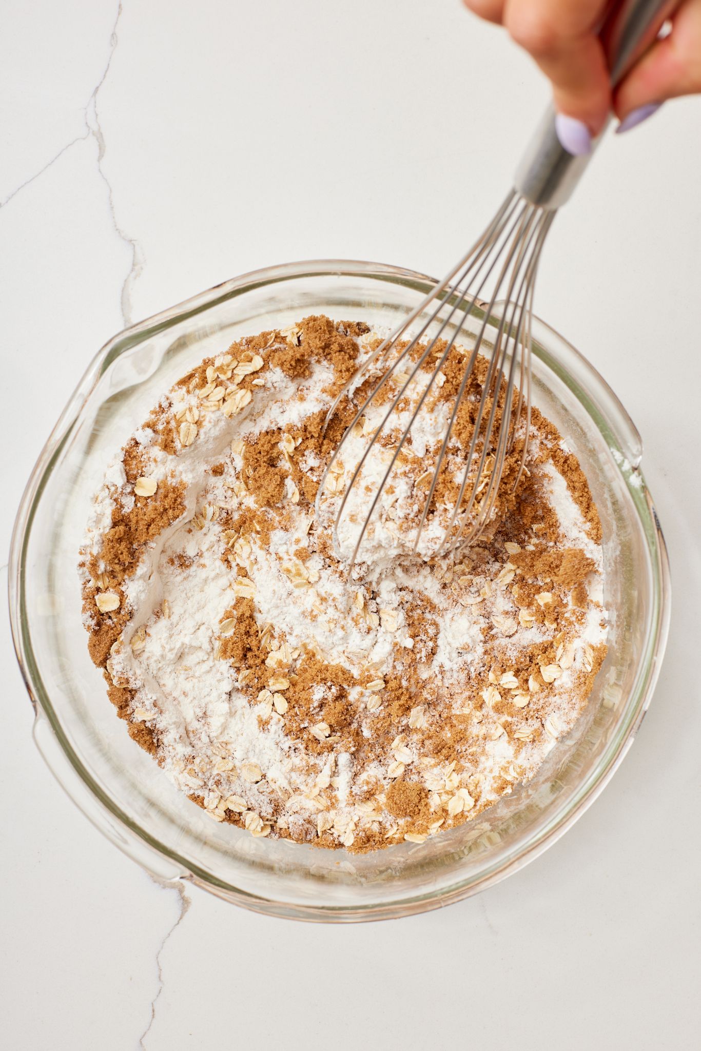 Step-by-step instructions on how to make Cranberry Oatmeal Bars: mix dry ingredients. 