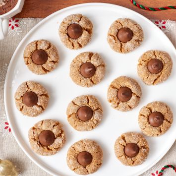 A top down view of Peanut Butter Blossoms on a platter.