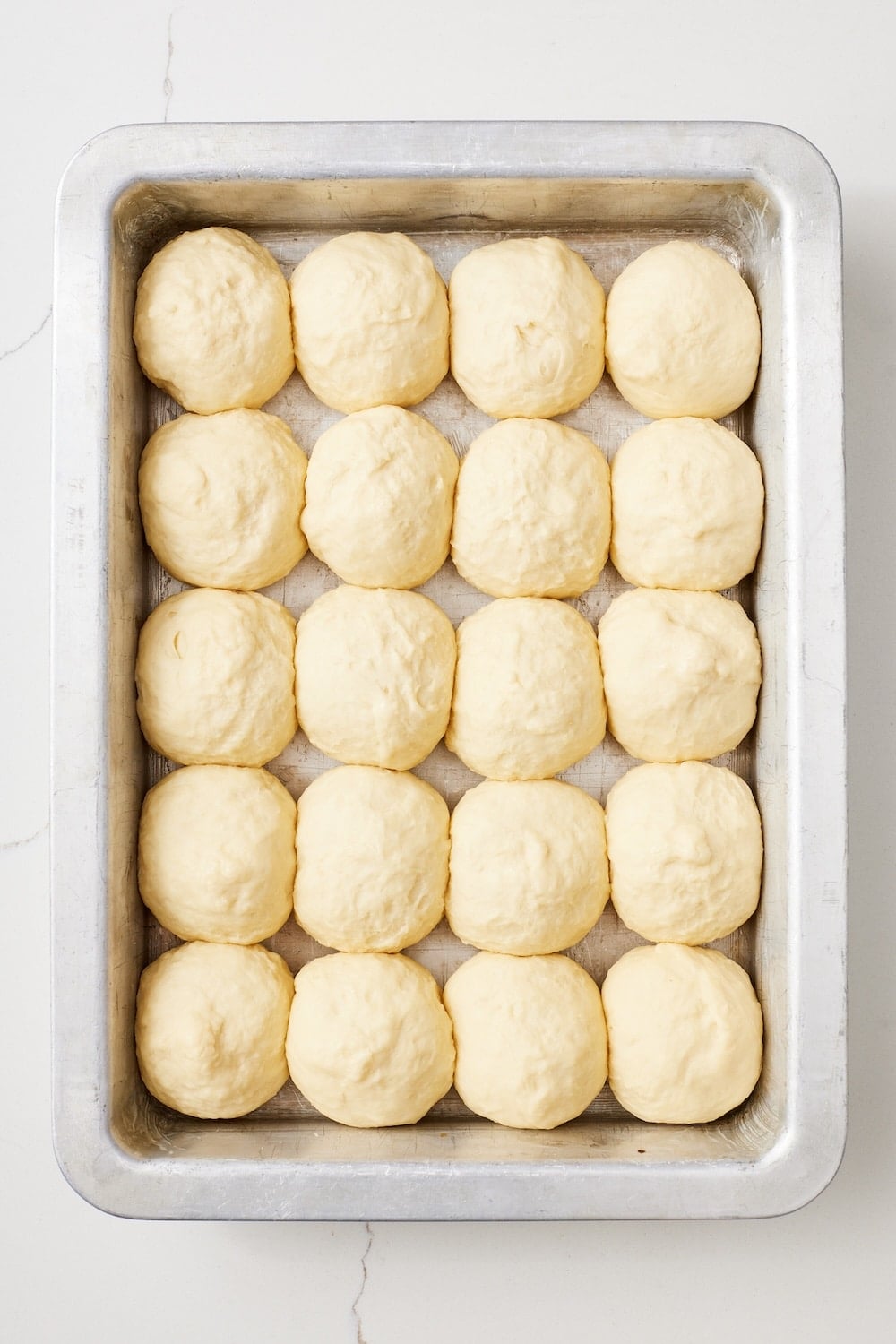 Hawaiian Rolls6 Divided and shaped dough balls proofed in the baking pan until doubled in size.
