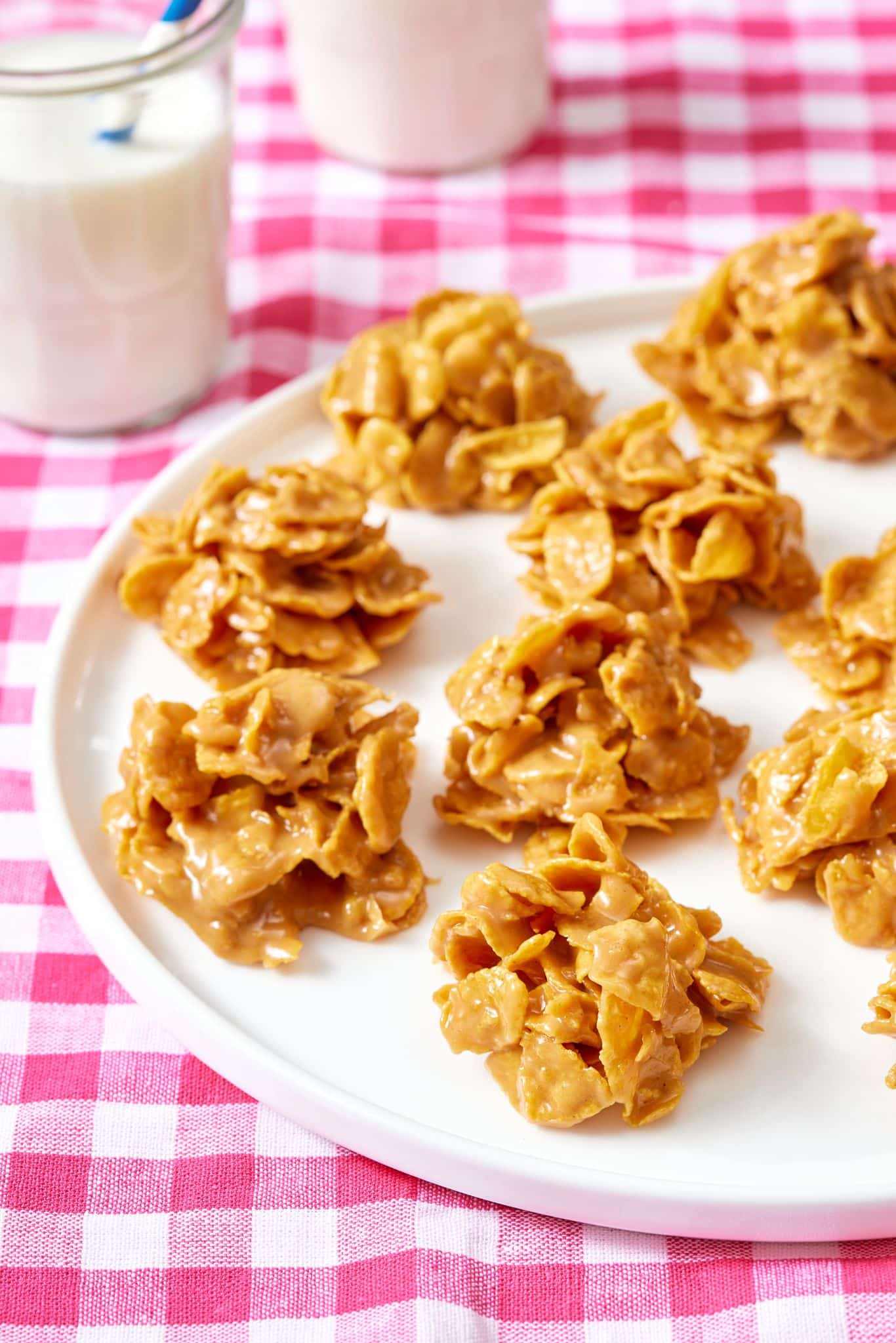 Close-up shot at peanut butter chews with two glasses of milk. 