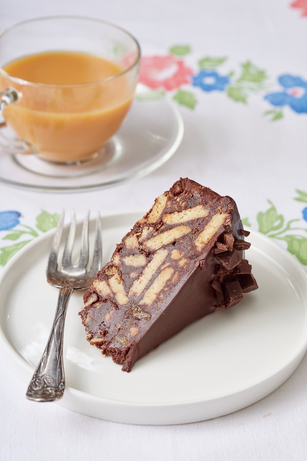 Chocolate Biscuit Cake16 A slice of Chocolate Biscuit Cake served with tea on the side.