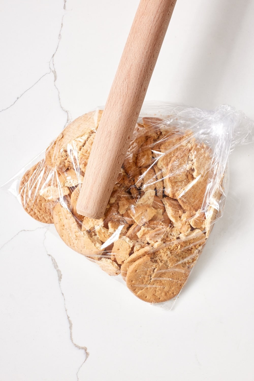 Chocolate Biscuit Cake2 Breaking up digestive biscuits in a ziplock bag with a rolling pin.