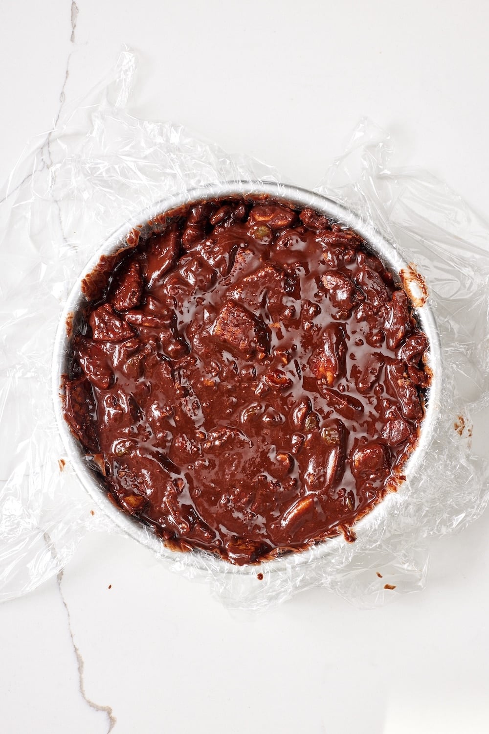 Chocolate Biscuit Cake6 Pour the chocolate biscuit cake batter into a plastic wrap lined cake pan.