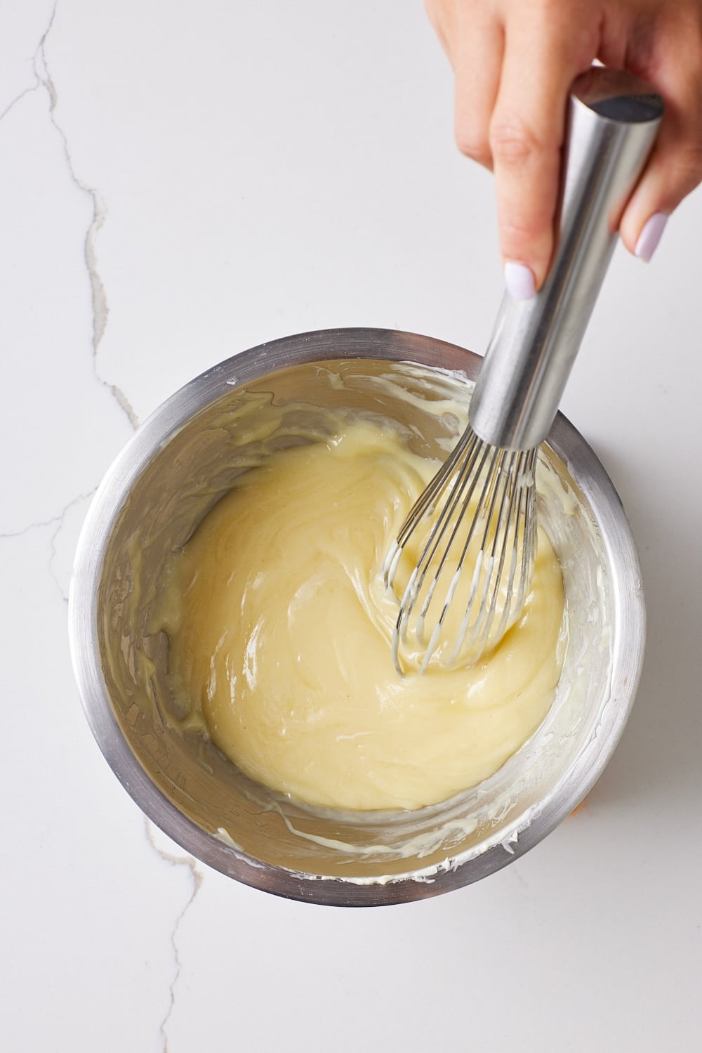 Eggnog Truffles4 Melt the chocolate: Gently melt the white chocolate in the top of a double boiler over simmering water.