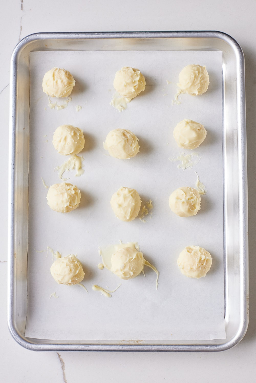 Eggnog Truffles7 Eggnog truffles chilling on the tray.