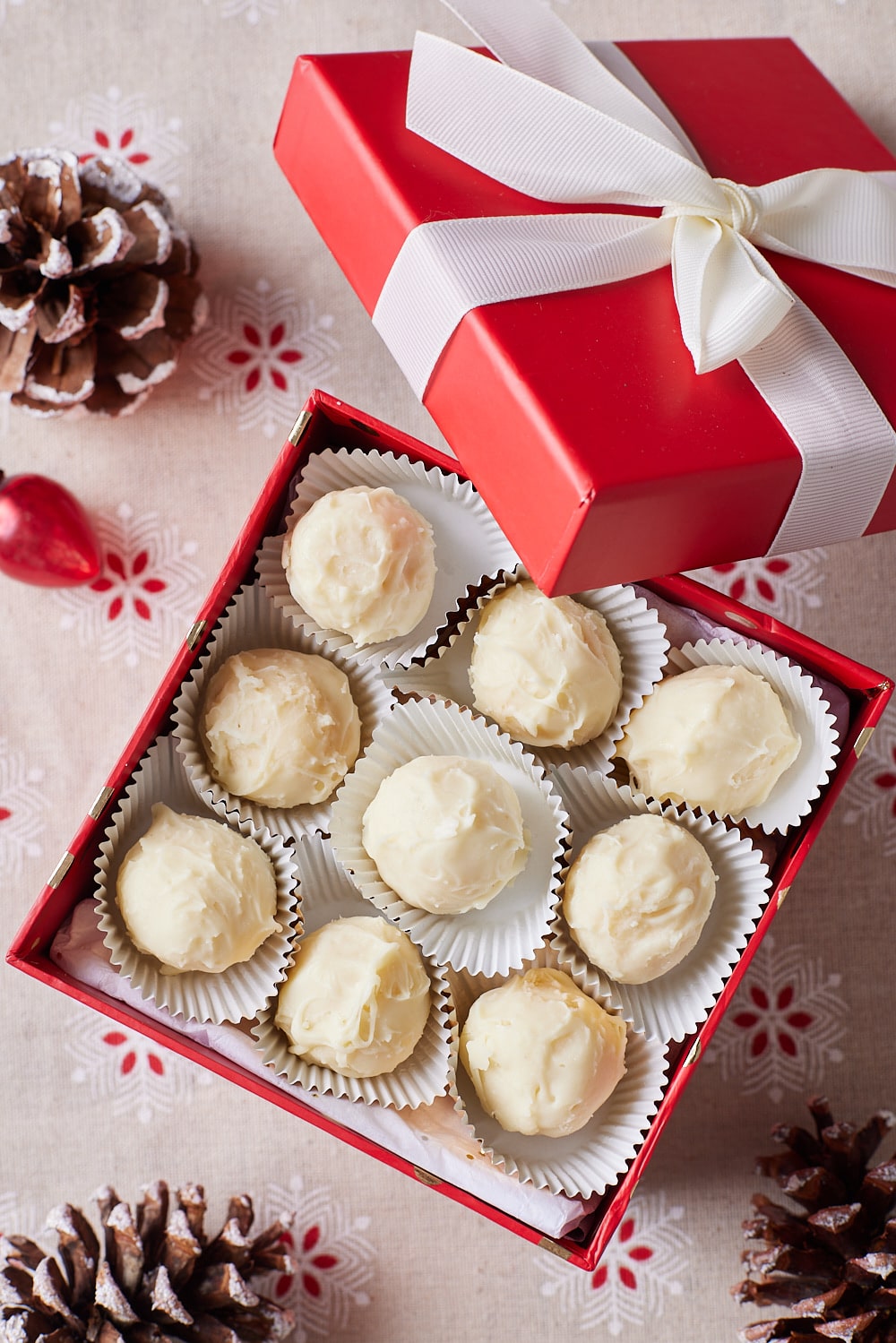 Eggnog Truffles8 Top-down view of a box of Eggnog Truffles coated with white chocolate.