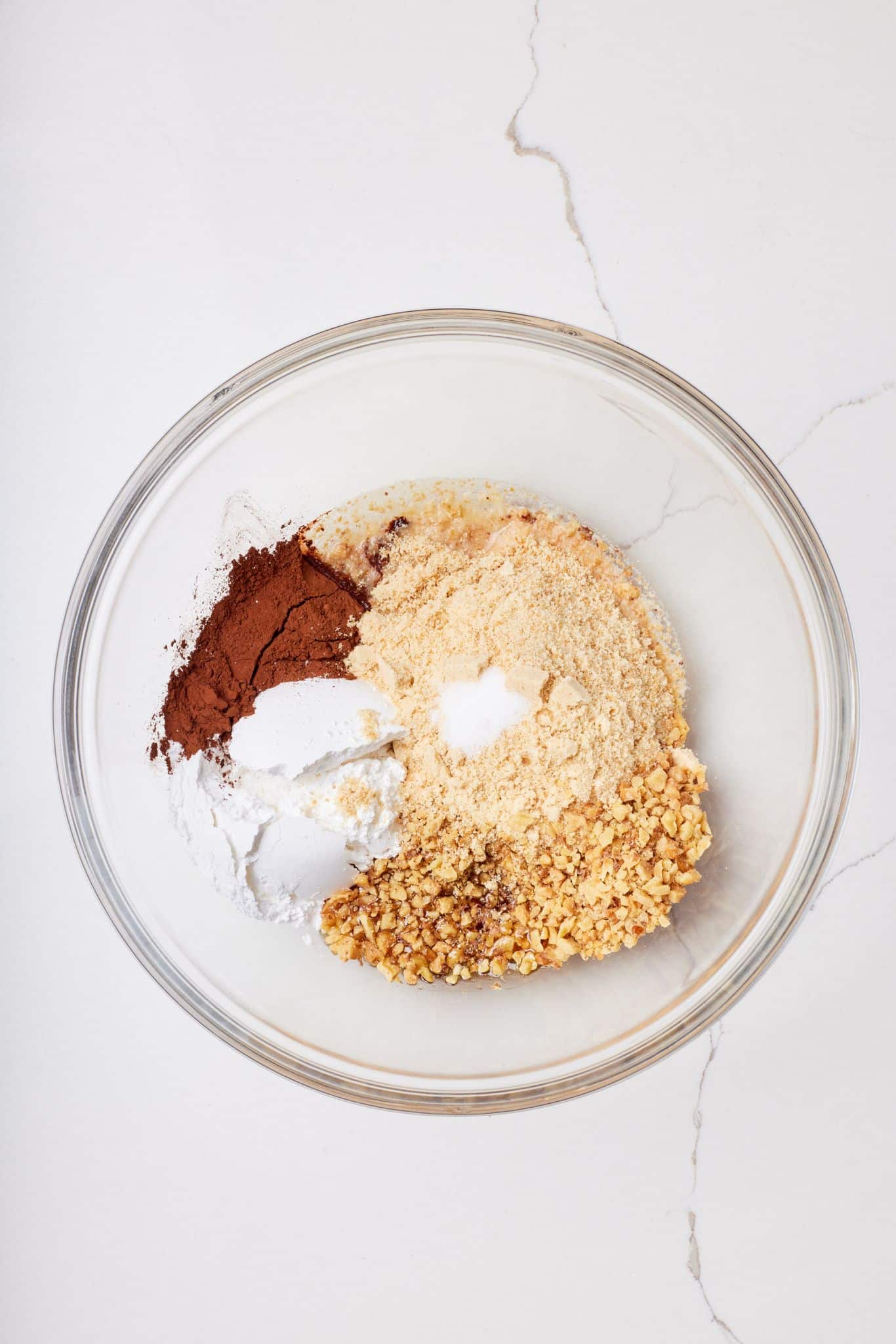 Mix dry ingredients of whiskey ball together in a glass bowl. 