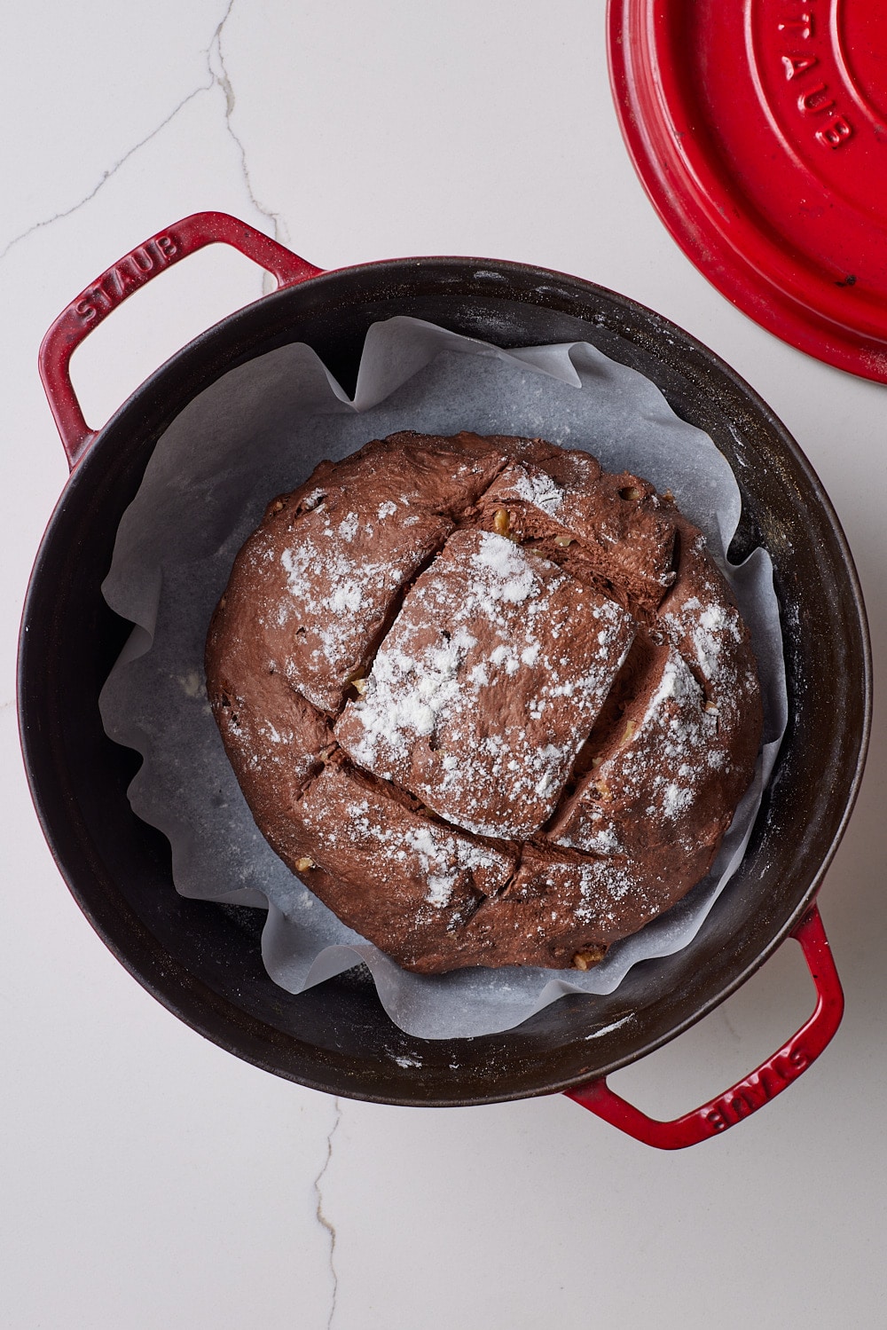 Chocolate Sourdough Bread10 A chocolate sourdough dusted with flour and scored on top in the dutch oven.