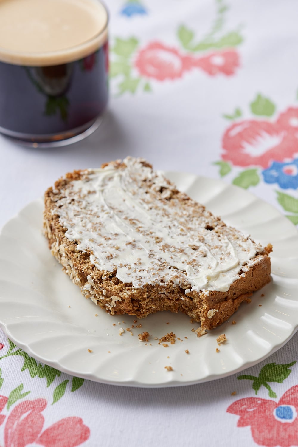 Guinness Bread8 A slice of Guinness bread served with butter and coffee on the side.