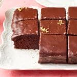 Easy Chocolate Frosting is used on the moist chocolate cake served on the platter.