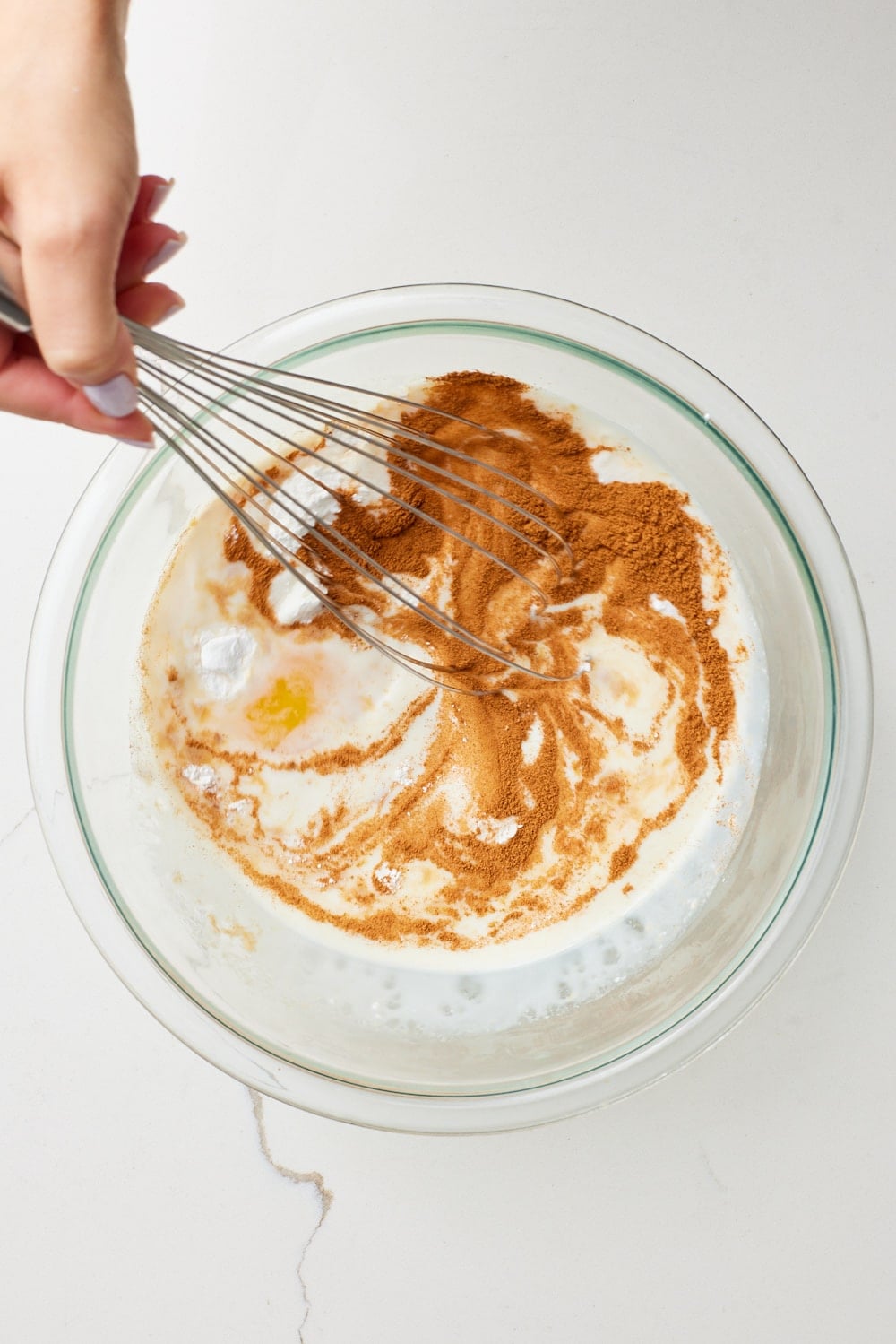 Carrot Cake Baked Oats2 In a large bowl, whisk together the eggs, whole milk, maple syrup, vanilla extract, baking powder, cinnamon, and salt until smooth.