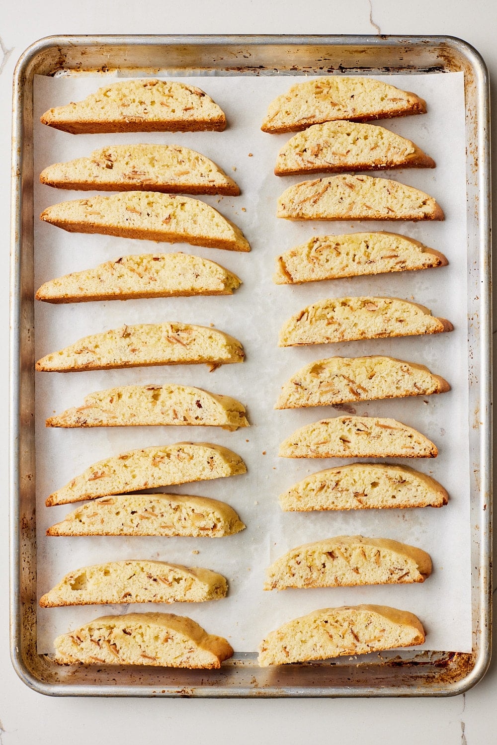 Arrange the biscotti cut side up on the baking sheet.
