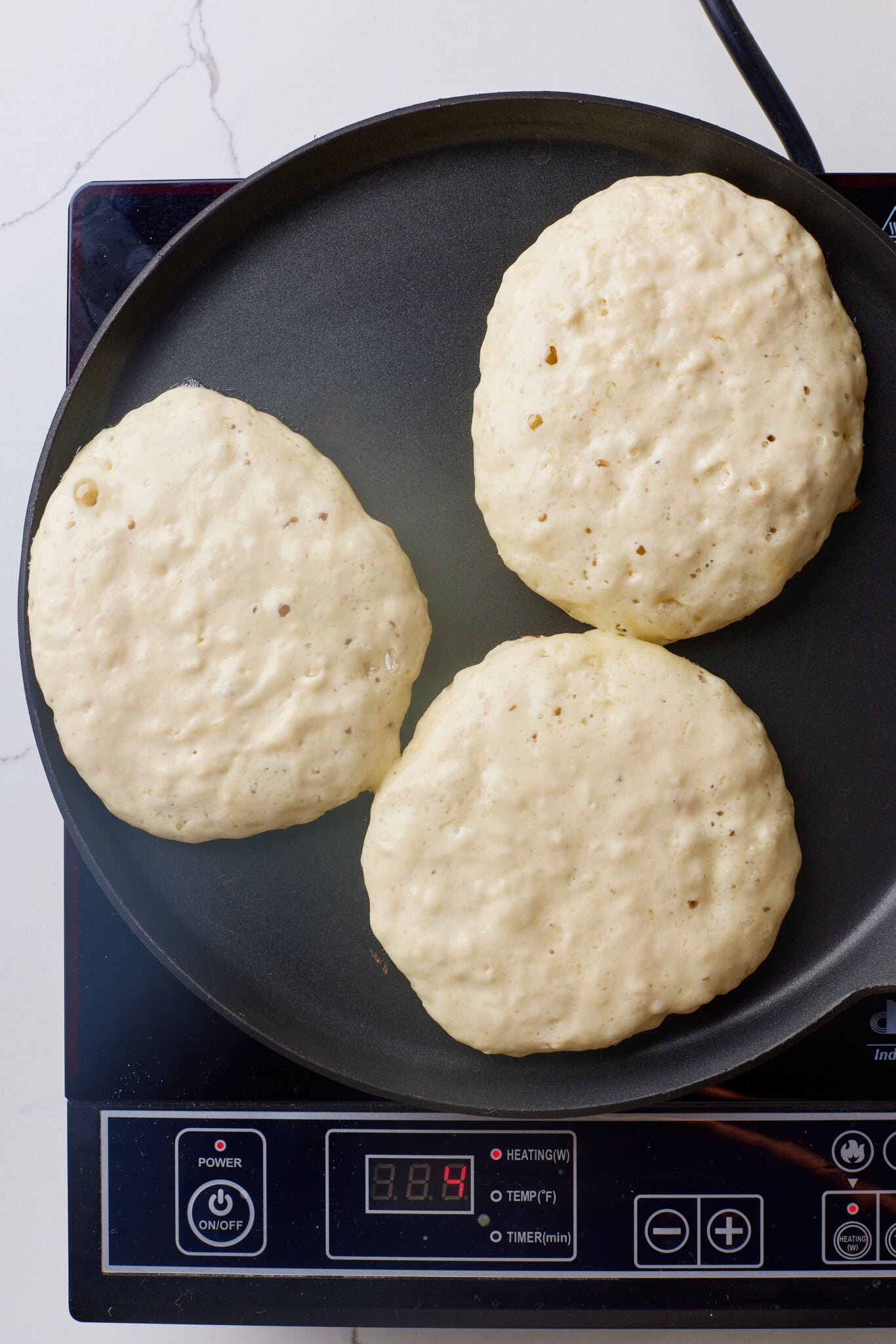 Cook until bubbles form on the surface and the edges look set, about 1½ minutes.