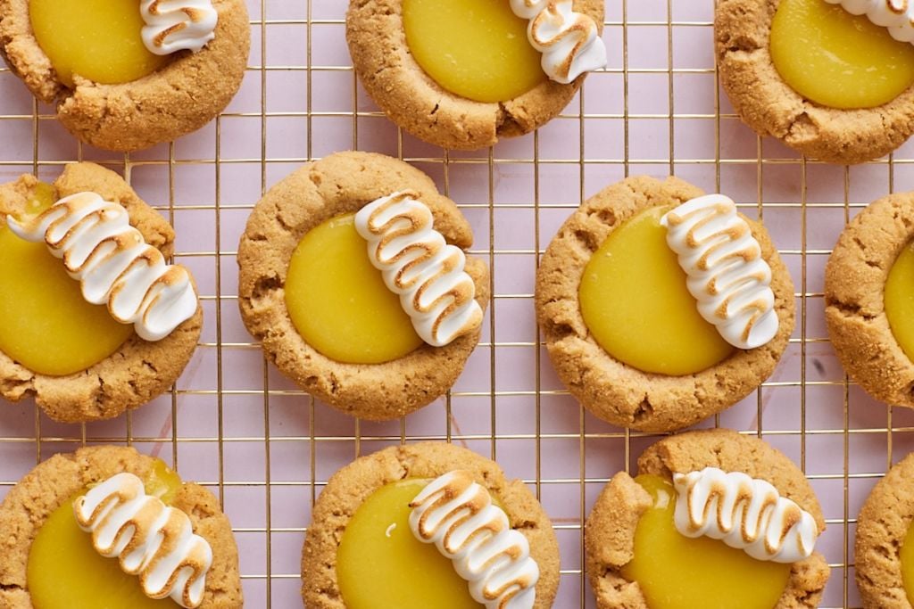 A top-down view of lemon meringue pie cookies with golden crust, silky filling and toasted marshmallows.