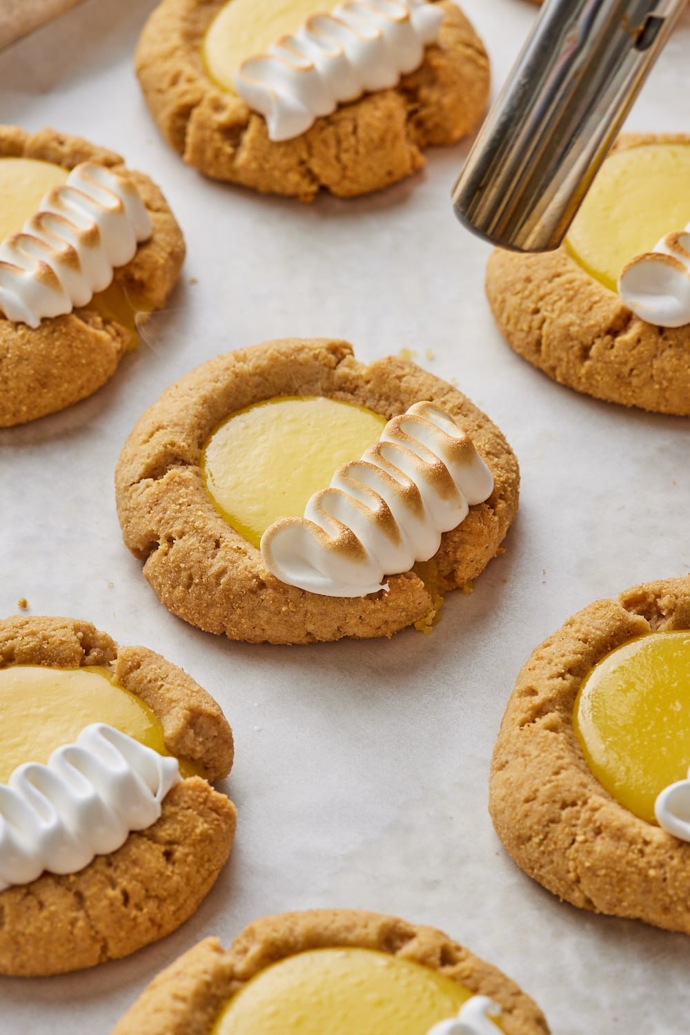 Lemon meringue pie cookies17 Finish cookies: Toast the meringue with a kitchen torch until lightly golden.