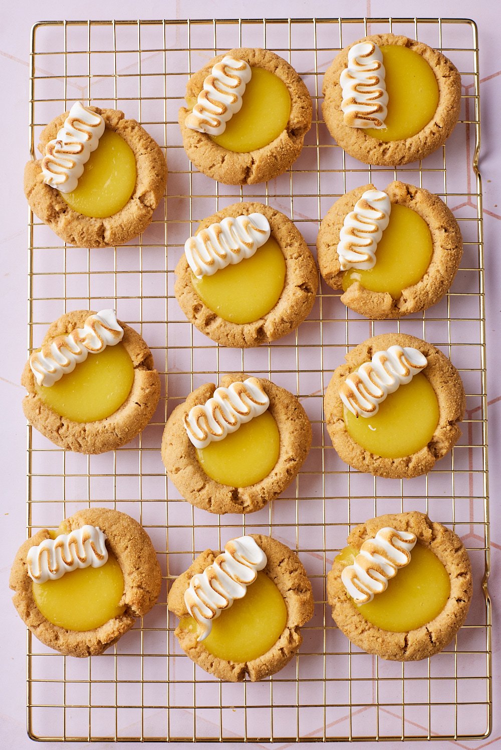 Lemon meringue pie cookies18 Golden Lemon Meringue Cookies with toasted marshmallow on the cooling rack.