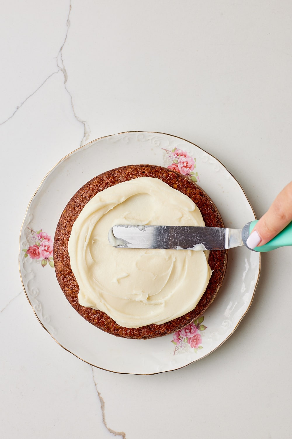 Small Carrot Cake Recipe7 Spread the frosting over the cake, leaving the sides exposed.