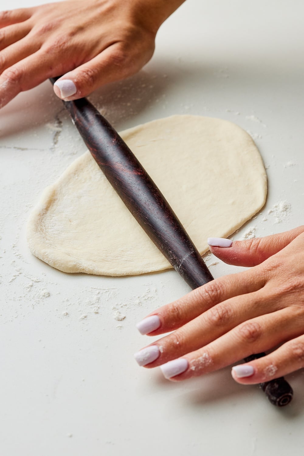 Roll each sourdough naan ball into an oval. 