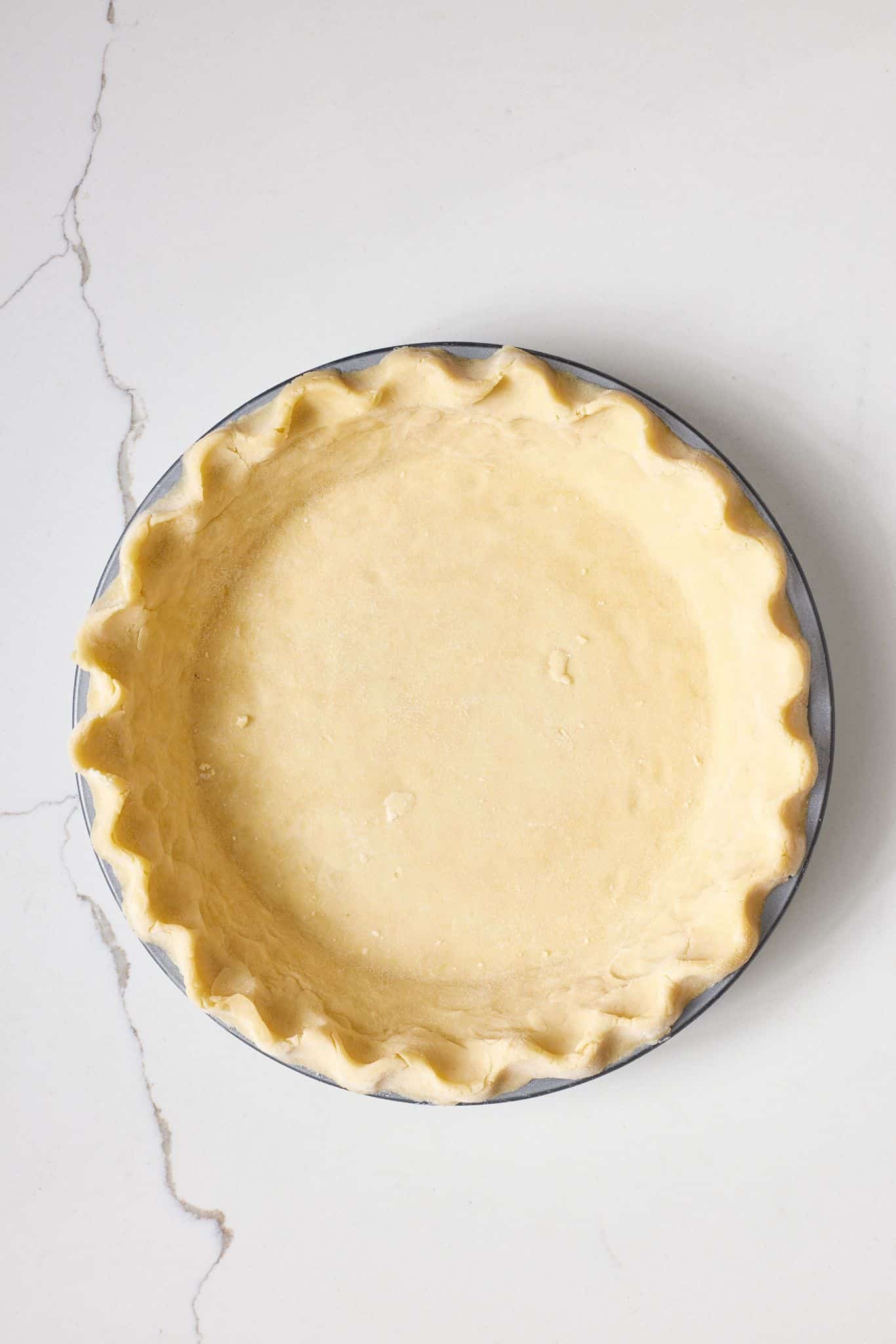Asparagus and Ham Quiche2 The baking pan is lined with pie crust.