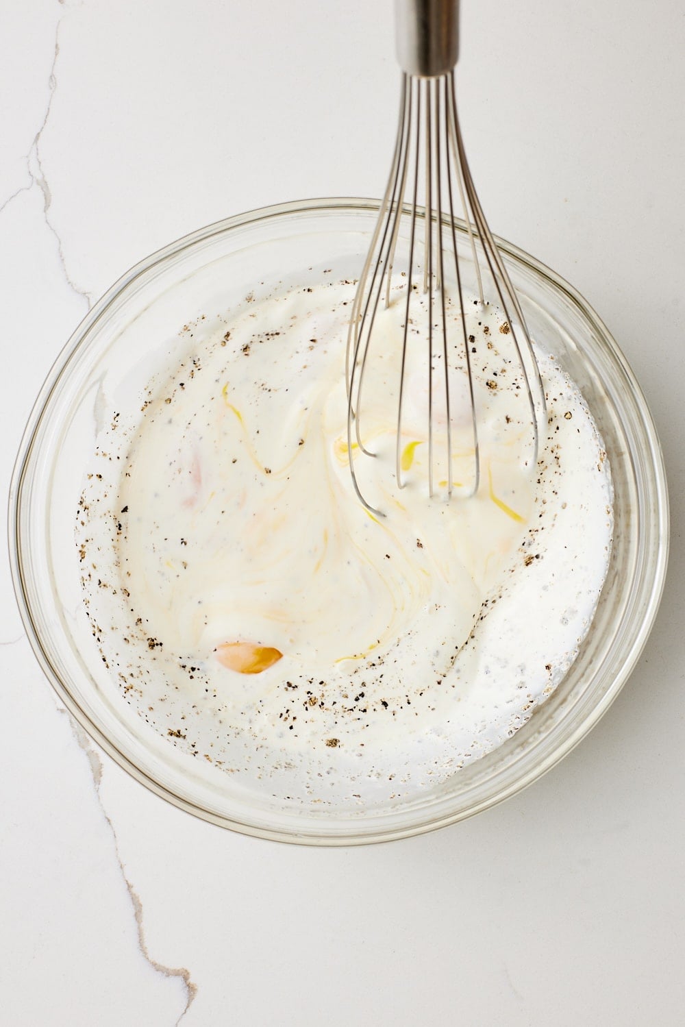 Asparagus and Ham quiche4 Mix filling: In a large bowl, whisk together the eggs, heavy cream, milk, salt, and black pepper until smooth.