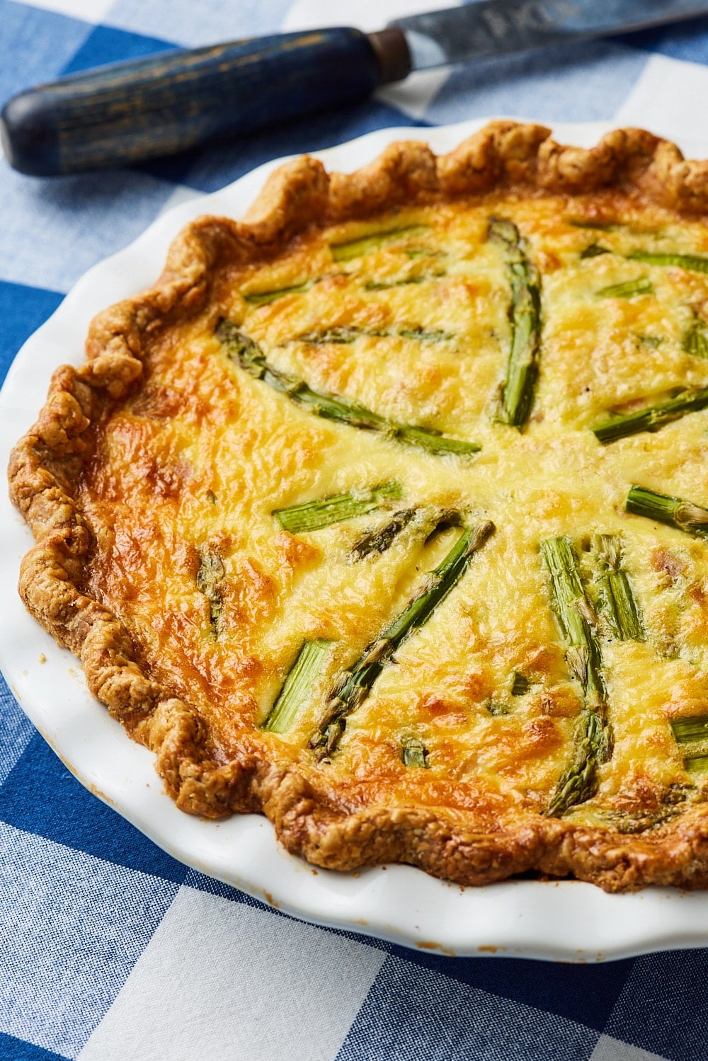 Asparagus and Ham quiche9 A whole asparagus and ham quiche with golden crust and bubbly filling.