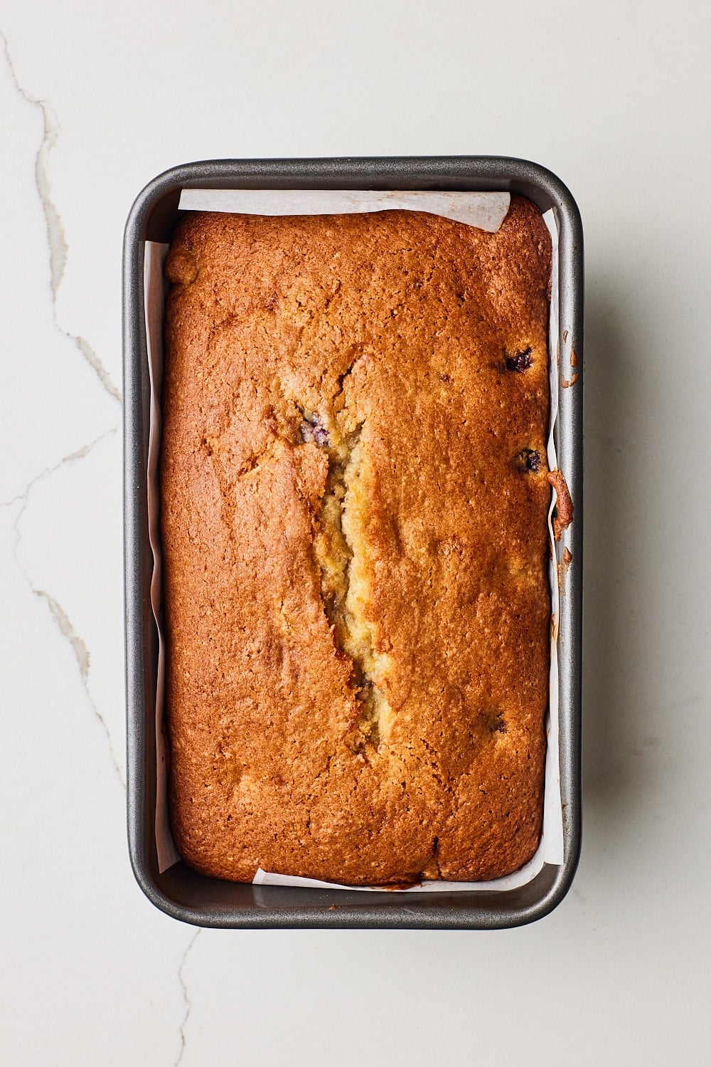 Lemon blueberry bread6 A loaf of Lemon Blueberry Bread baked golden brown.