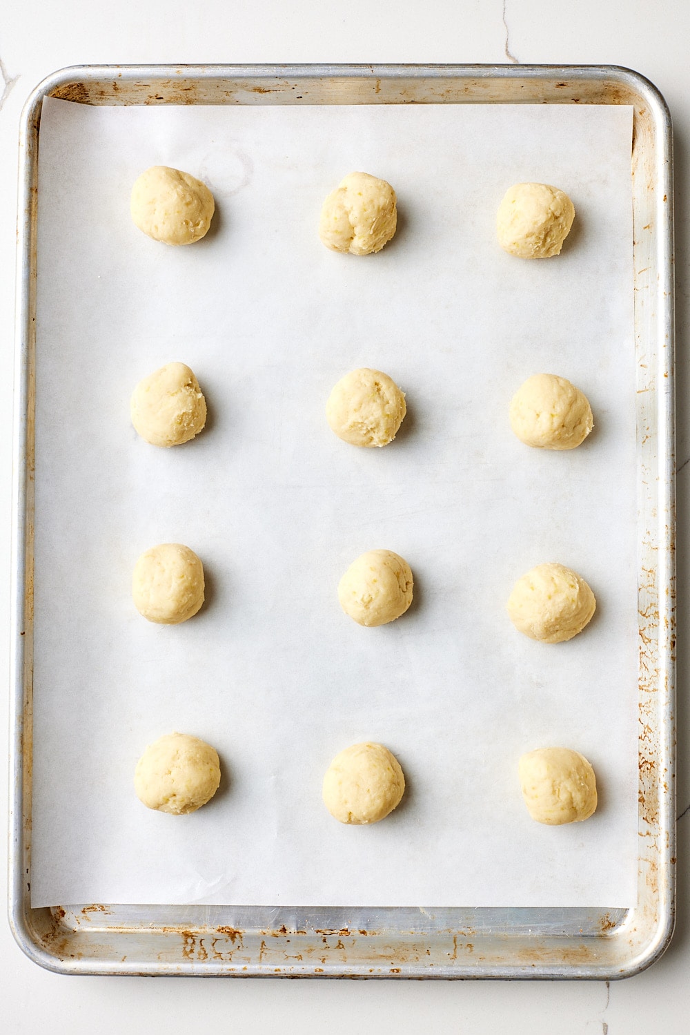 Lemon ricotta cookies4 Lemon Ricotta Cookie dough balls are placed 2 inches (5 cm) apart on the prepared baking sheets.