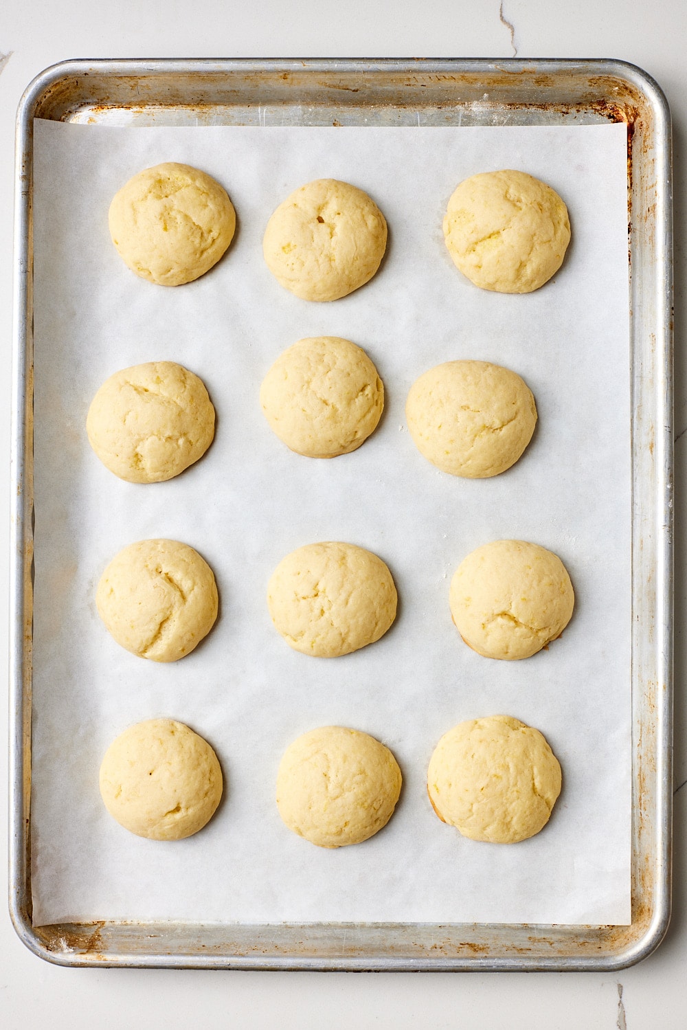 Lemon ricotta cookies5 Bake Lemon Ricotta Cookies until the bottoms are lightly golden, but the tops remain pale.