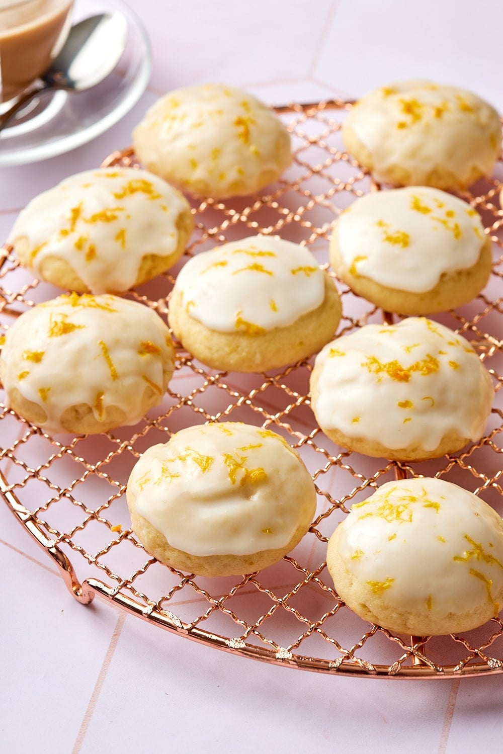 Lemon ricotta cookies8 Lemon Ricotta Cookies with glossy glaze and lemon zest on the wire rack.