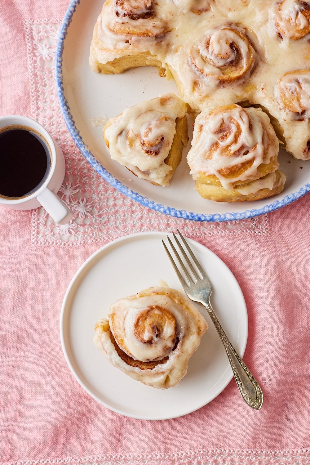 Sourdough Cinnamon Rolls18 Sourdough cinnamon roll is glazed and served with coffee.