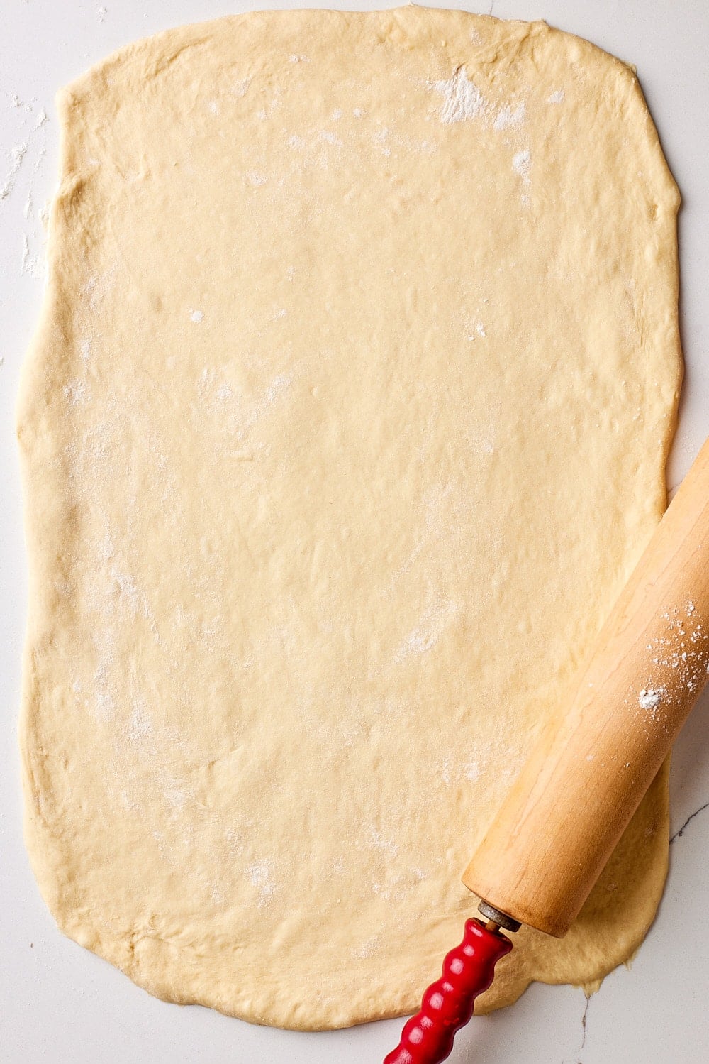Sourdough Cinnamon Rolls8 Roll the dough of sourdough cinnamon roll out into a rectangle.