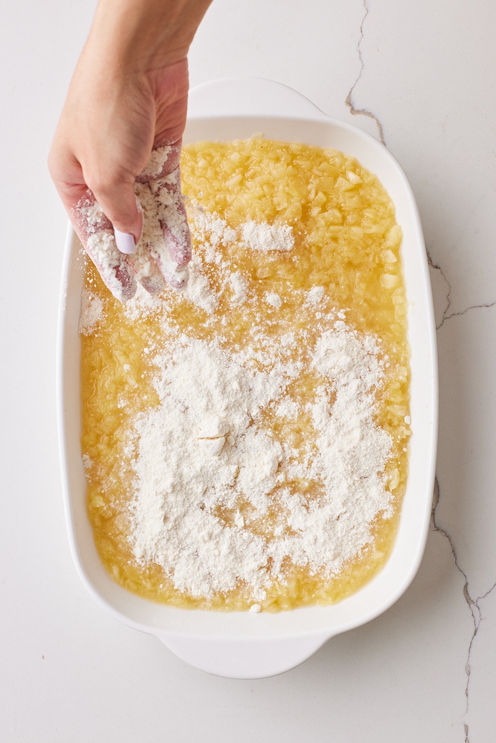 Pineapple Dump Cake3 Spread cake mix to the fruit.