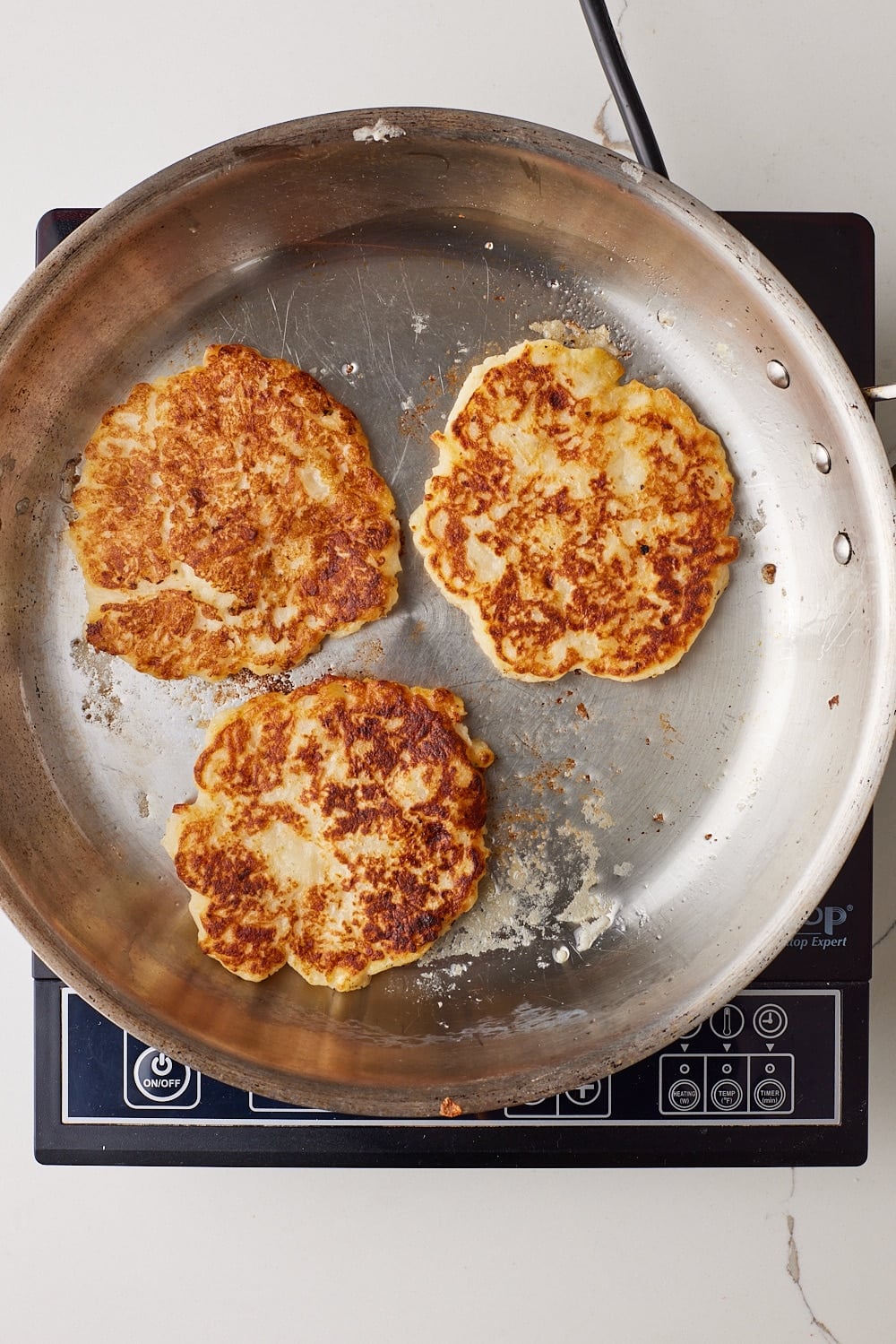 Boxty10 Boxty Irish Potato Pancakes cooked until golden and though in the pan.