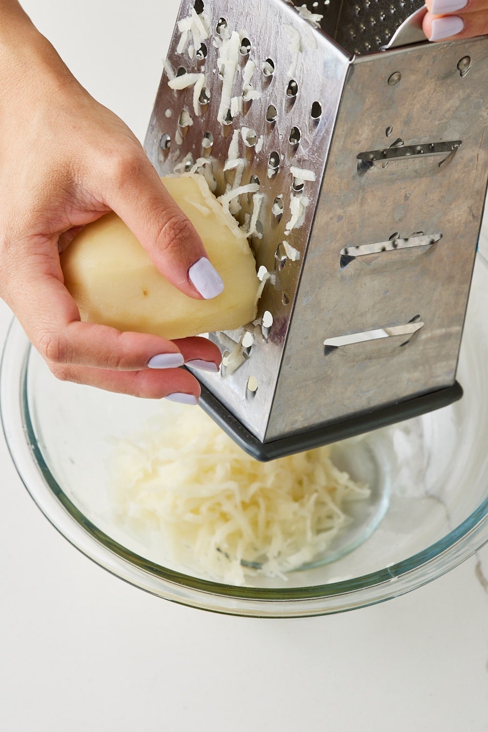 Boxty2 Grate one peeled potato into a bowl.