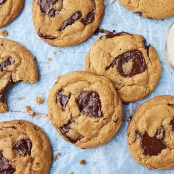 Top down view of Brown Butter Chocolate Chip Cookies served with milk on the side.