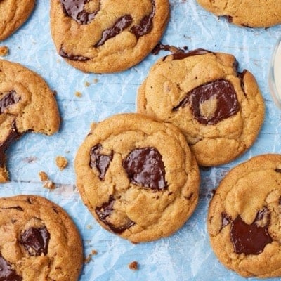 Top down view of Brown Butter Chocolate Chip Cookies served with milk on the side.