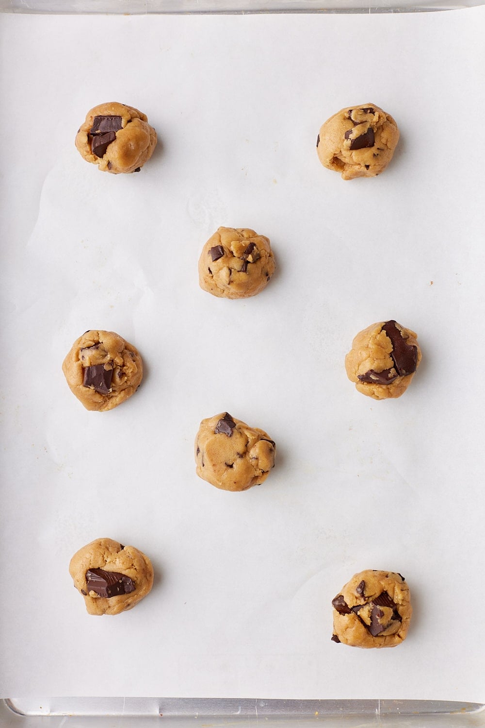 Brown Butter Chocolate Chip Cookies5 Scoop the dough into 2-tablespoon (about 1 ½ oz / 40 g) portions and arrange half of the dough balls on each cookie sheet, evenly spaced apart.
