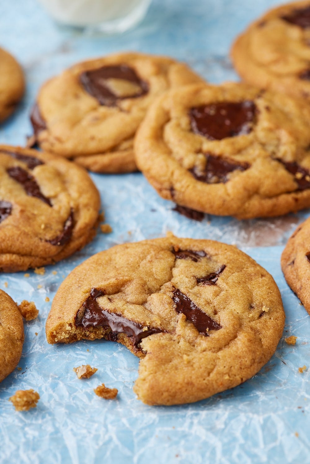 Brown Butter Chocolate Chip Cookies8 Brown Butter Chocolate Chip Cookies with one bite taken.