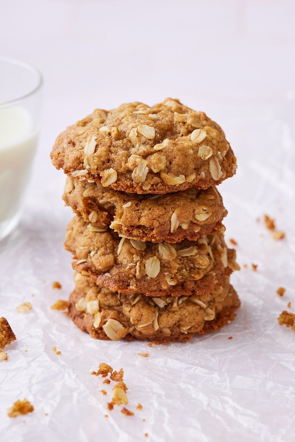 Brown Butter Oatmeal Cookies10 A stack of puffed golden browned butter oatmeal cookies.