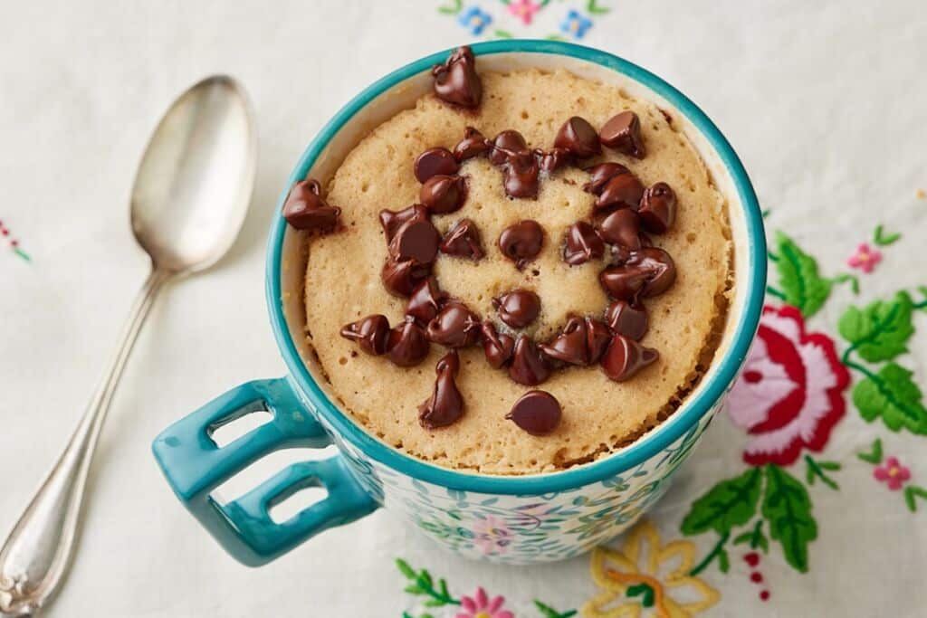 Chocolate Chip Mug Cake with a spoon on the left.